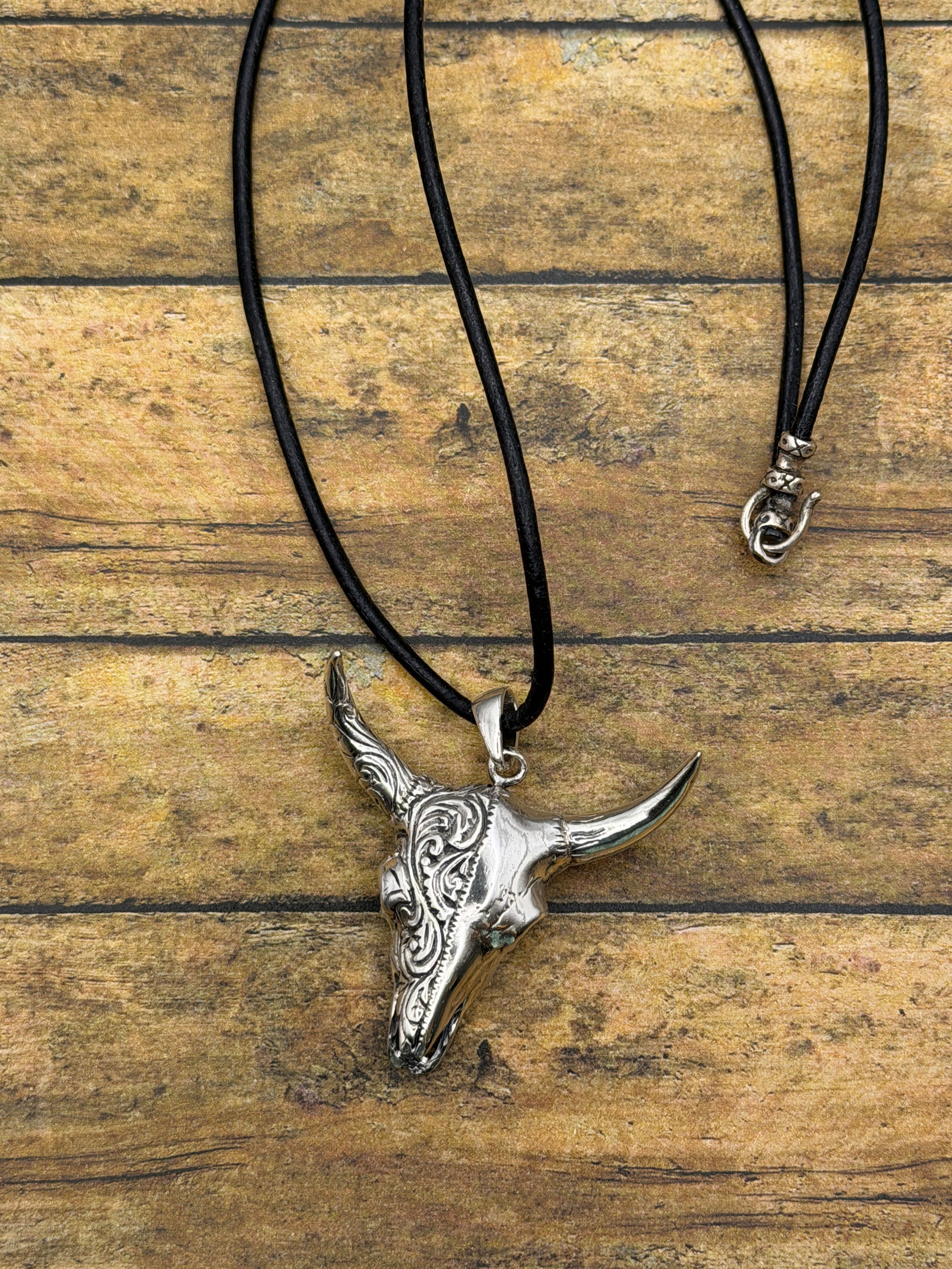 Brandy-Sterling Silver Engraved Cow Skull Pendant on Leather Rope