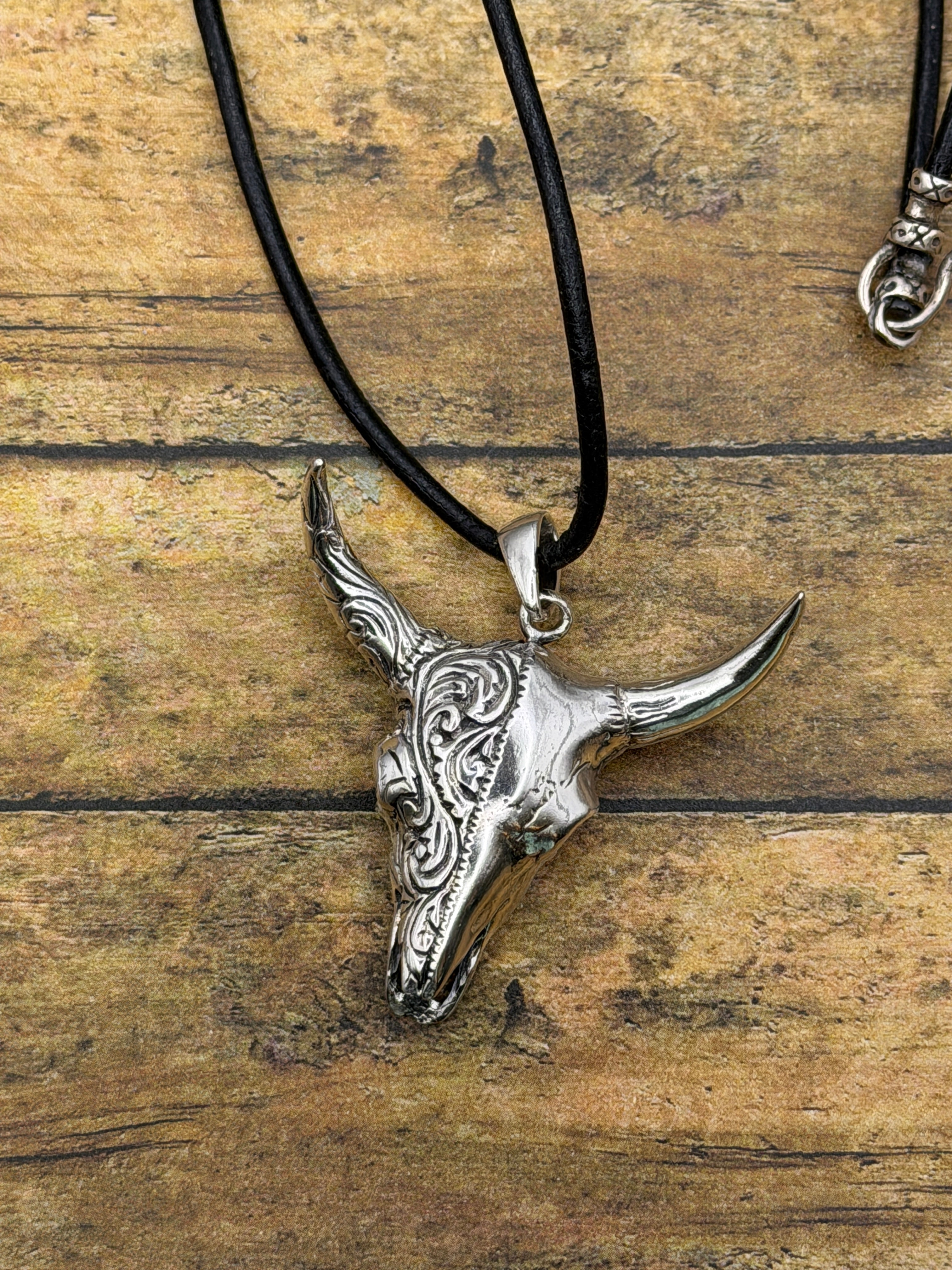 Brandy-Sterling Silver Engraved Cow Skull Pendant on Leather Rope