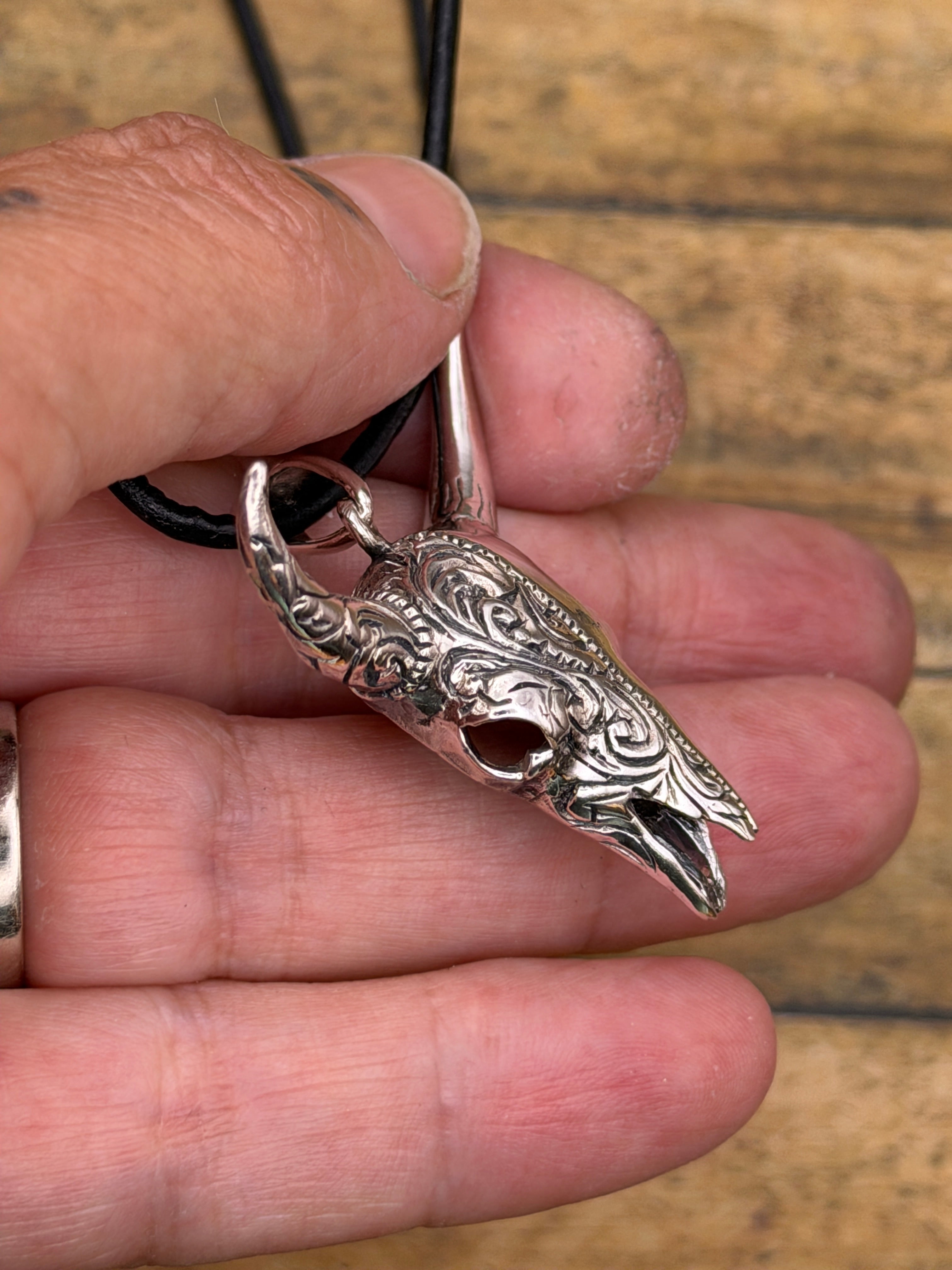 Brandy-Sterling Silver Engraved Cow Skull Pendant on Leather Rope