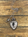 Wilma-Black Scorpion in White Resin Heart Charm Necklace with Scorpion and Fangs Charm